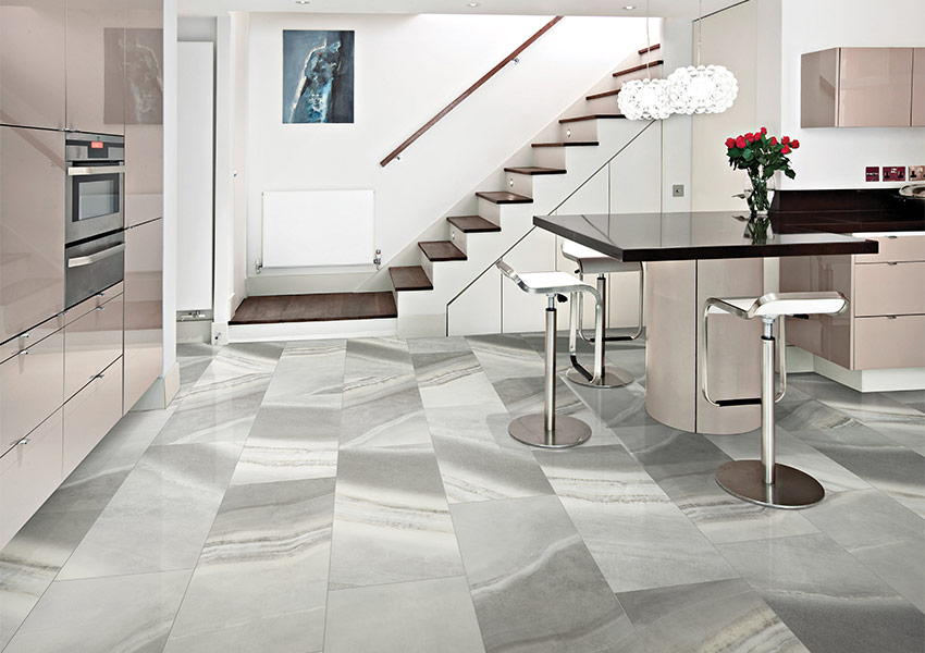 stone look large format luxury vinyl tile flooring in modern kitchen